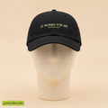 AI Works For Me, I Don't Work For It hat in black, embroidered with AI WORKS FOR ME and a green underline, on a foam mannequin head