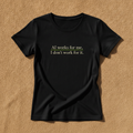 AI Works For Me, I Don't Work For It fitted tee in black, printed with the phrase in small cream serif lettering, laid flat