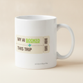 My AI Booked This Trip mug in white, printed with a cream boarding pass reading MY AI BOOKED THIS TRIP with a plane icon