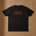 Token Usage Quota tee in black, printed with ERROR QUOTA EXCEEDED in red, laid flat on a tan background