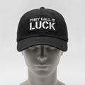 Grind Stencil hat in black with a THEY CALL IT LUCK stencil patch, shown on a gray mannequin head