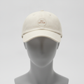 Quiet Luck hat in cream with a small round they call it luck. patch, shown on a gray mannequin head