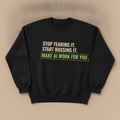 Make AI Work For You sweater in black, with STOP FEARING IT. START BOSSING IT. and MAKE AI WORK FOR YOU in a caution striped box, laid flat